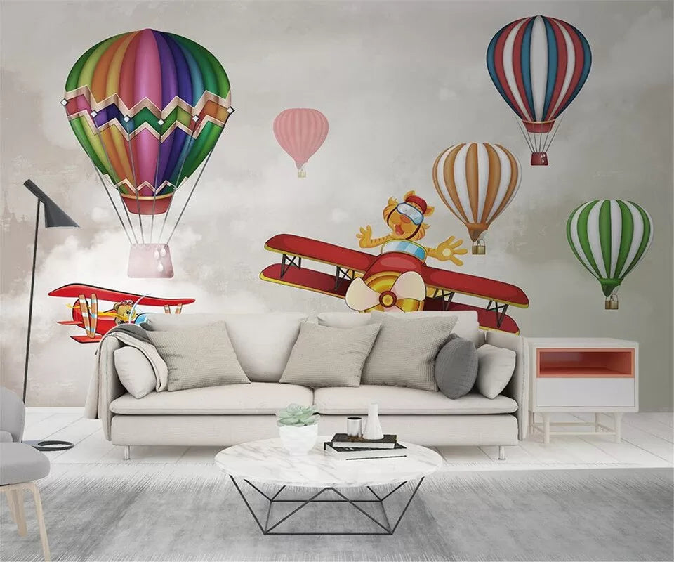 Papier peint enfant avions et montgolfières colorées